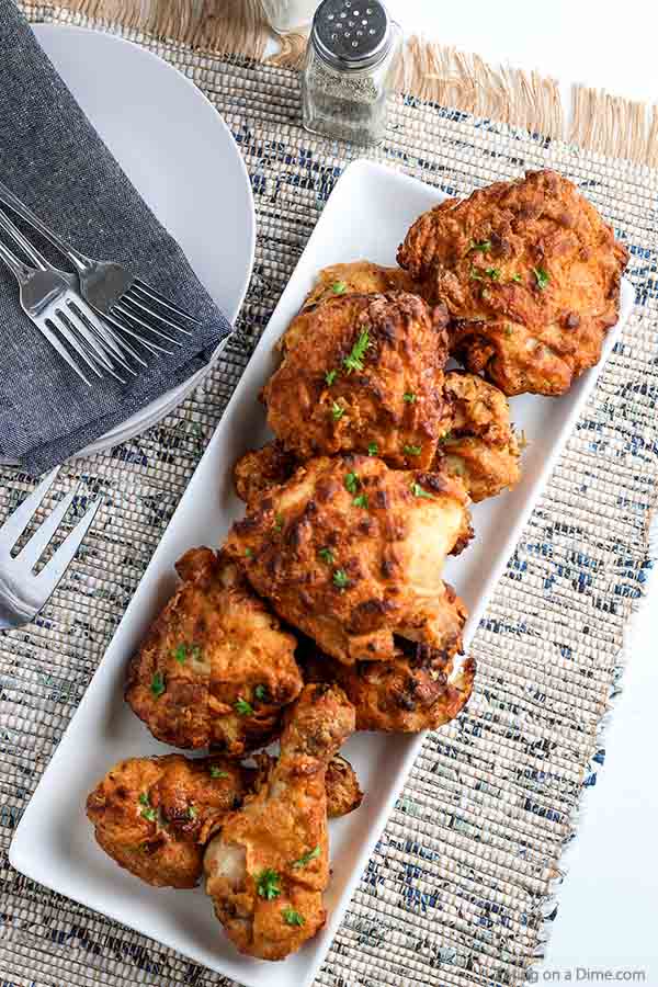 Air Fryer Fried Chicken is a game changer. Enjoy crispy fried chicken without all of the work or fat. It's delicious and really simple. Try making drumsticks, wings, thighs or anything you prefer. This recipe is super easy and the best flavor with buttermilk. #eatingonadime #airfryerfriedchicken