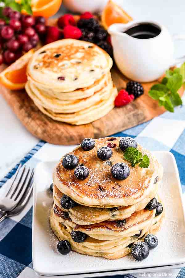 Enjoy light and fluffy pancakes when you make Blueberry pancakes recipe. It is so easy to make blueberry pancakes recipe homemade. Try the best blueberry pancakes recipe. #eatingonadime #blueberrypancakeseasy