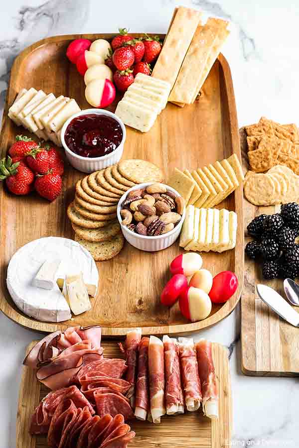 Fruit and large pieces of cheese and crackers add to a Charcuterie Board