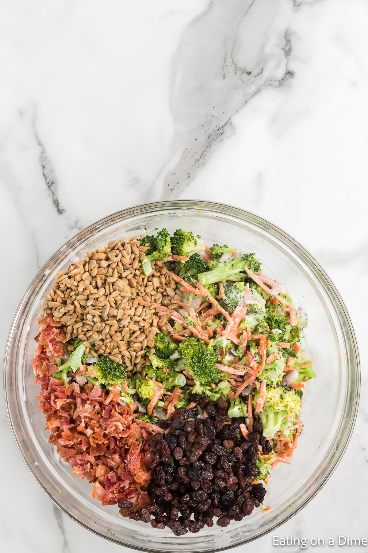 Stir in raisins, bacon and seeds with the broccoli mixture