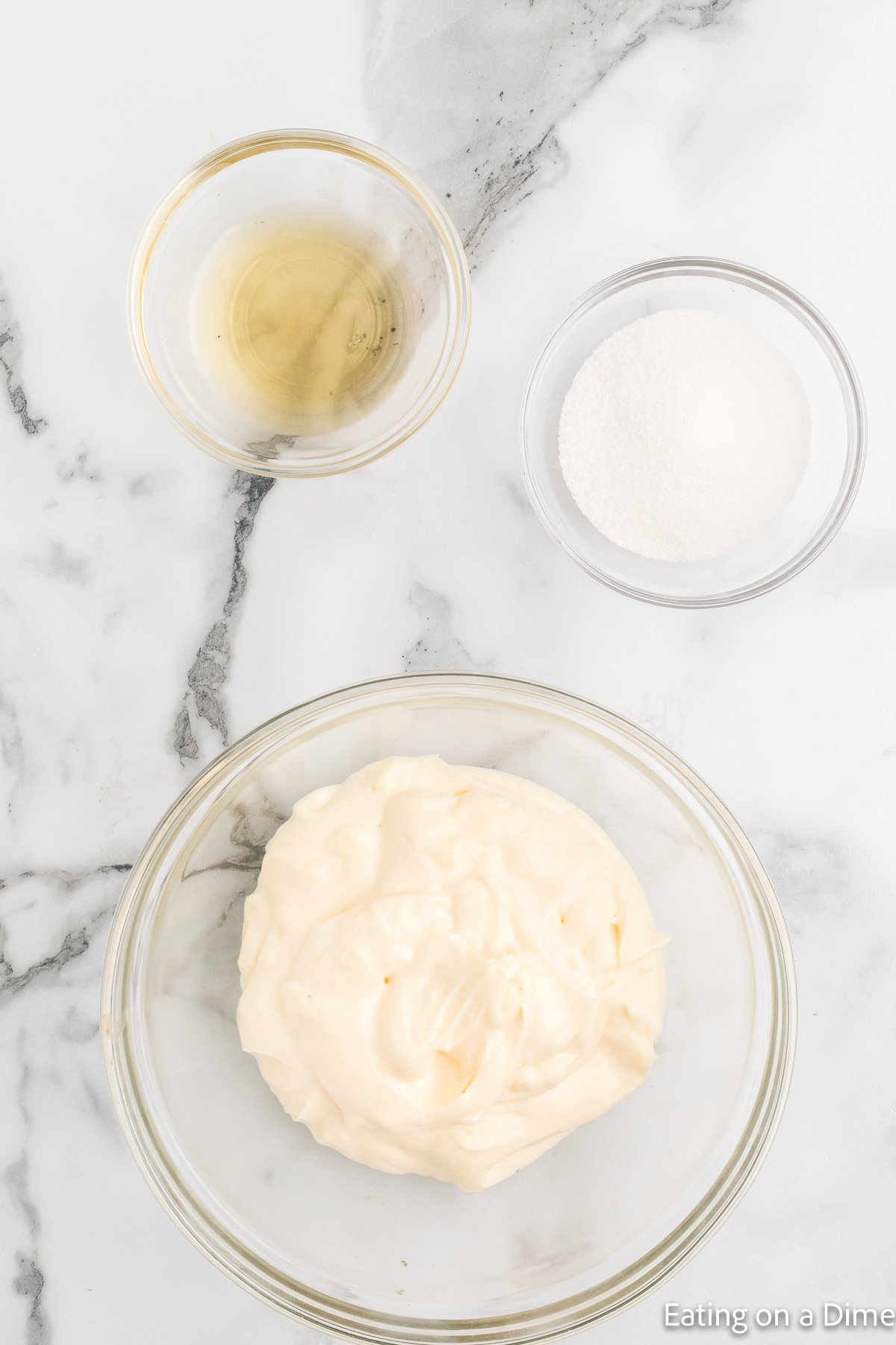 Mixing the salad dressing ingredients together in a bowl