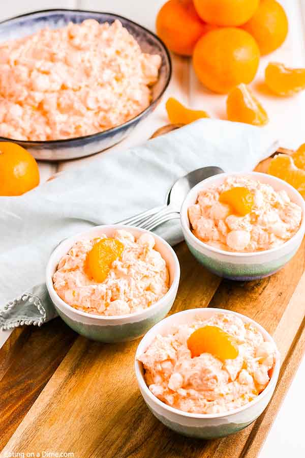 Mandarin orange jello salad recipe with cottage cheese has just 6 ingredients and takes minutes to prepare. Whipped topping, jello, manderine and more make this salad delicious and fluffy. Enjoy this tropical salad with pineapple and cool whip. #eatingonadime #mandarinorangejellosaladrecipe #mandarinpineapple 