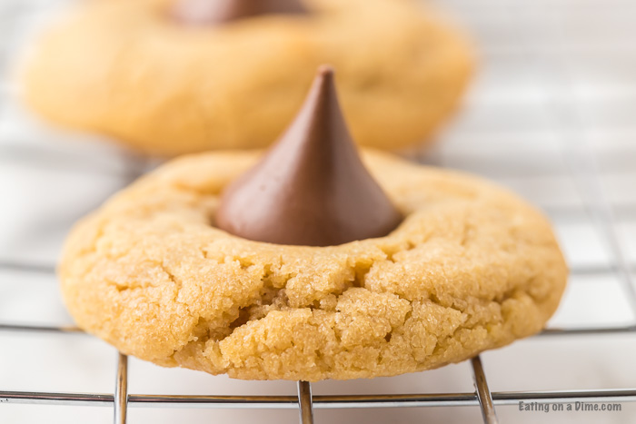 These Peanut Butter Kiss Cookies are fun to make and taste delicious.  You'll be surprised by how easy these are and everyone will love them!