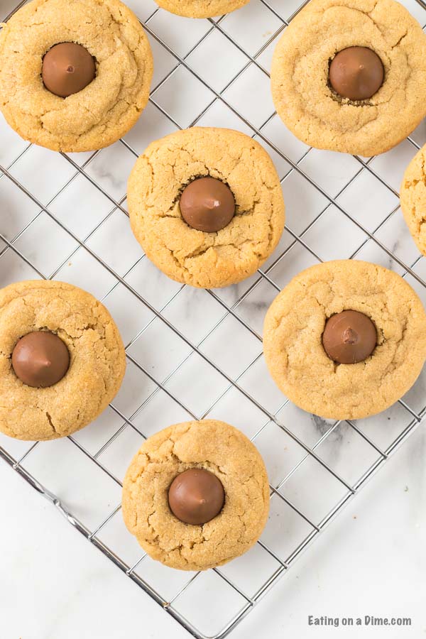 These Peanut Butter Kiss Cookies are fun to make and taste delicious.  You'll be surprised by how easy these are and everyone will love them!