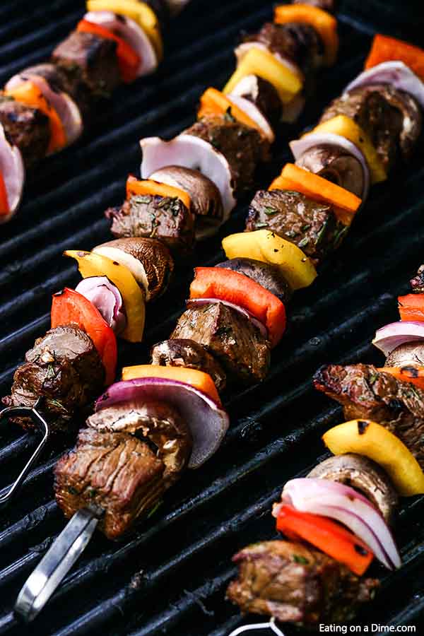 Grilled steak kabobs recipe has everything you need for a great meal. Flavorful steak and tender veggies combine on the grill beef skewers for an amazing dinner. The easy marinade is flavorful. #eatingonadime #marinadedgrillsteakkabobs
