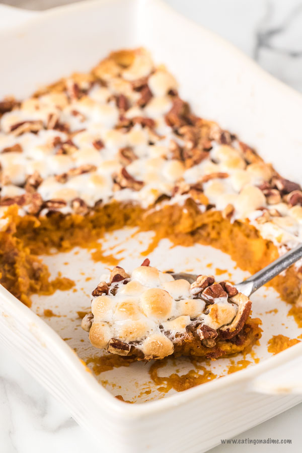 There isn't anything more classic than delicious Sweet potato casserole. Layers of sweet potatoes topped with marshmallows and with pecans make this so tasty. This easy recipe with marshmallows and pecans is one of the best Thanksgiving recipes. #eatingonadime #*sweetpotatocasserole 