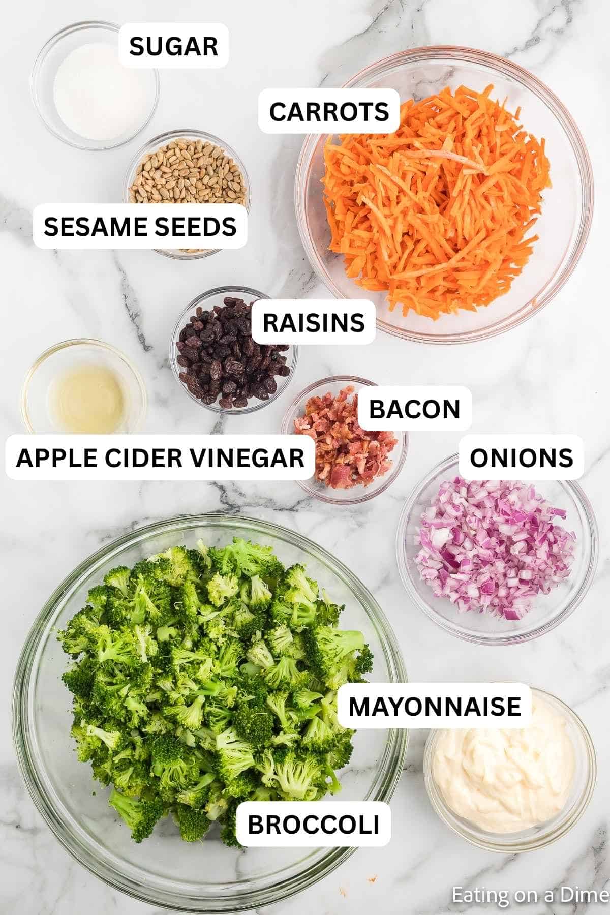 If you're loking for a quick, flavor packed side dish, this broccoli salad recipe is it! It's crunchy, sweet and salty all combined in one delicious salad. Ingredients needed for broccoli salad - broccoli florets, carrots, red onion, mayo, sugar, apple cider vinegar, raisins, bacon, and sunflower seeds.