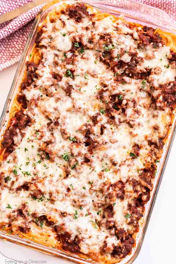 Million dollar spaghetti recipe has so much delicious cheese, ground Italian sausage and tons of flavor. This savory meal comes together in minutes for the best casserole without cottage cheese. Enjoyed baked spaghetti with ricotta, sour cream, cream cheese and more. #eatingonadime #milliondollarspaghetti #easydinners