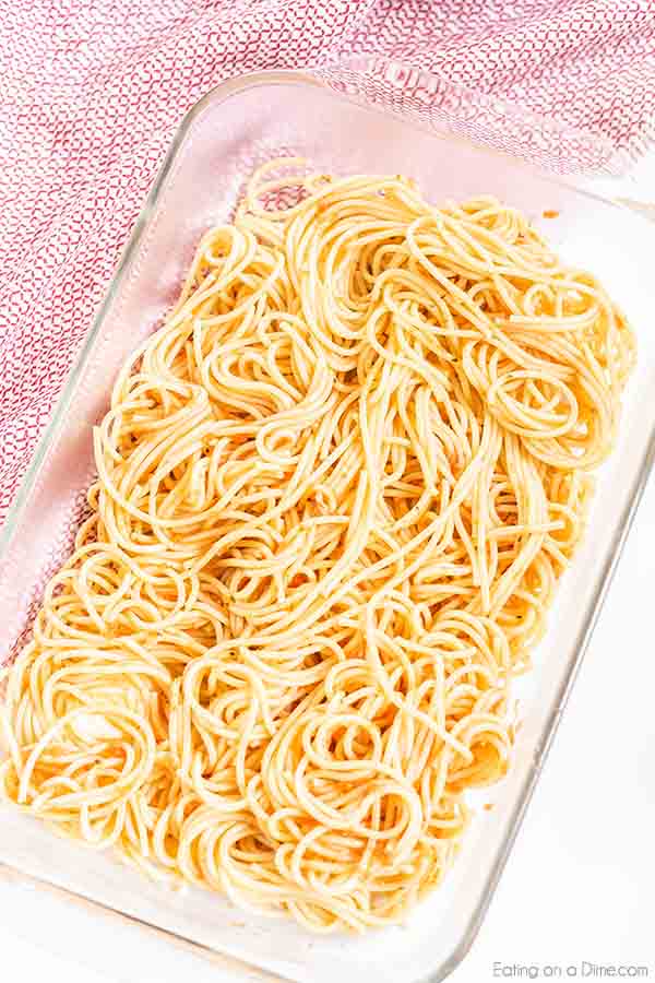 Million dollar spaghetti recipe has so much delicious cheese, ground Italian sausage and tons of flavor. This savory meal comes together in minutes for the best casserole without cottage cheese. Enjoyed baked spaghetti with ricotta, sour cream, cream cheese and more. #eatingonadime #milliondollarspaghetti #easydinners