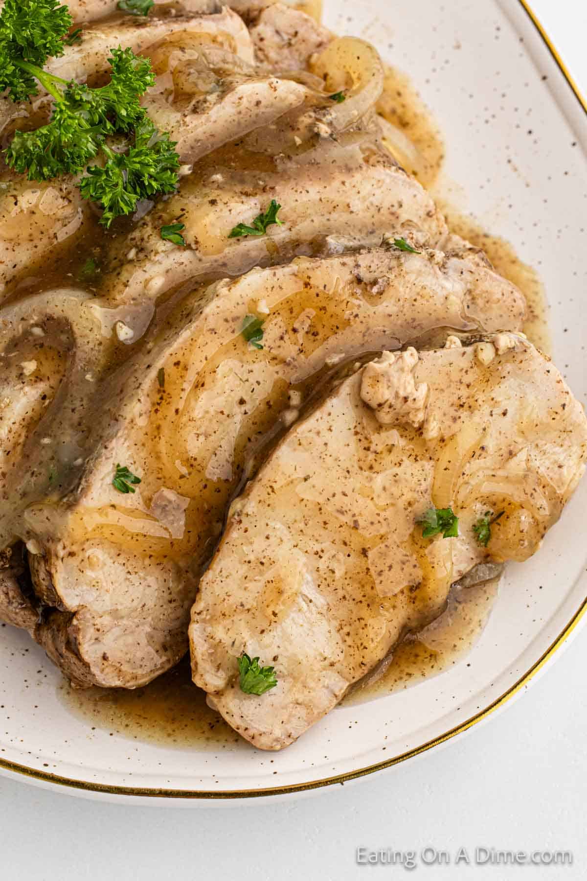 Close up image of slice pork loin with gravy