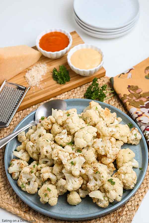 Air fryer cauliflower recipe is so delicious that even your non veggie loving kids will love this recipe. The air fryer makes it crispy and flavorful. Enjoy this easy cauliflower dish while eating healthy and low carb. #eatingonadime #airfryercauliflowerrecipes #keto #glutenfree #whole30