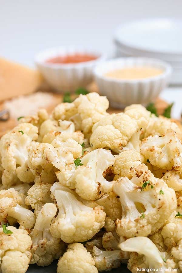 Air fryer cauliflower recipe is so delicious that even your non veggie loving kids will love this recipe. The air fryer makes it crispy and flavorful. Enjoy this easy cauliflower dish while eating healthy and low carb. #eatingonadime #airfryercauliflowerrecipes #keto #glutenfree #whole30