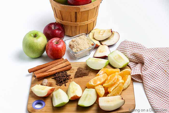 Apple Cider Ingredients - apples, oranges, whole cloves, cinnamon sticks, allspice, nutmeg, water, brown sugar