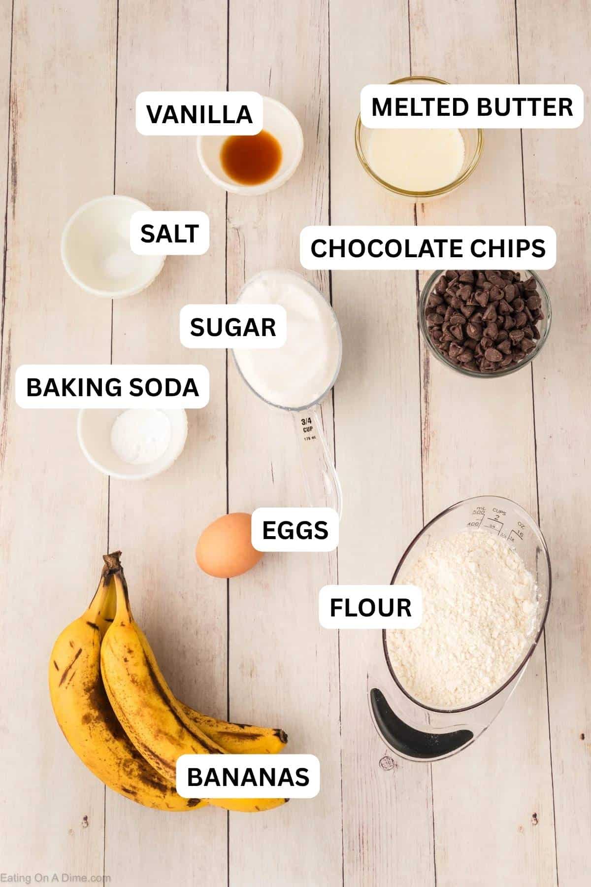 Ingredients needed to make this recipe which includes bananas, butter, eggs, sugar, vanilla, baking soda, salt, flour, and chocolate chips.