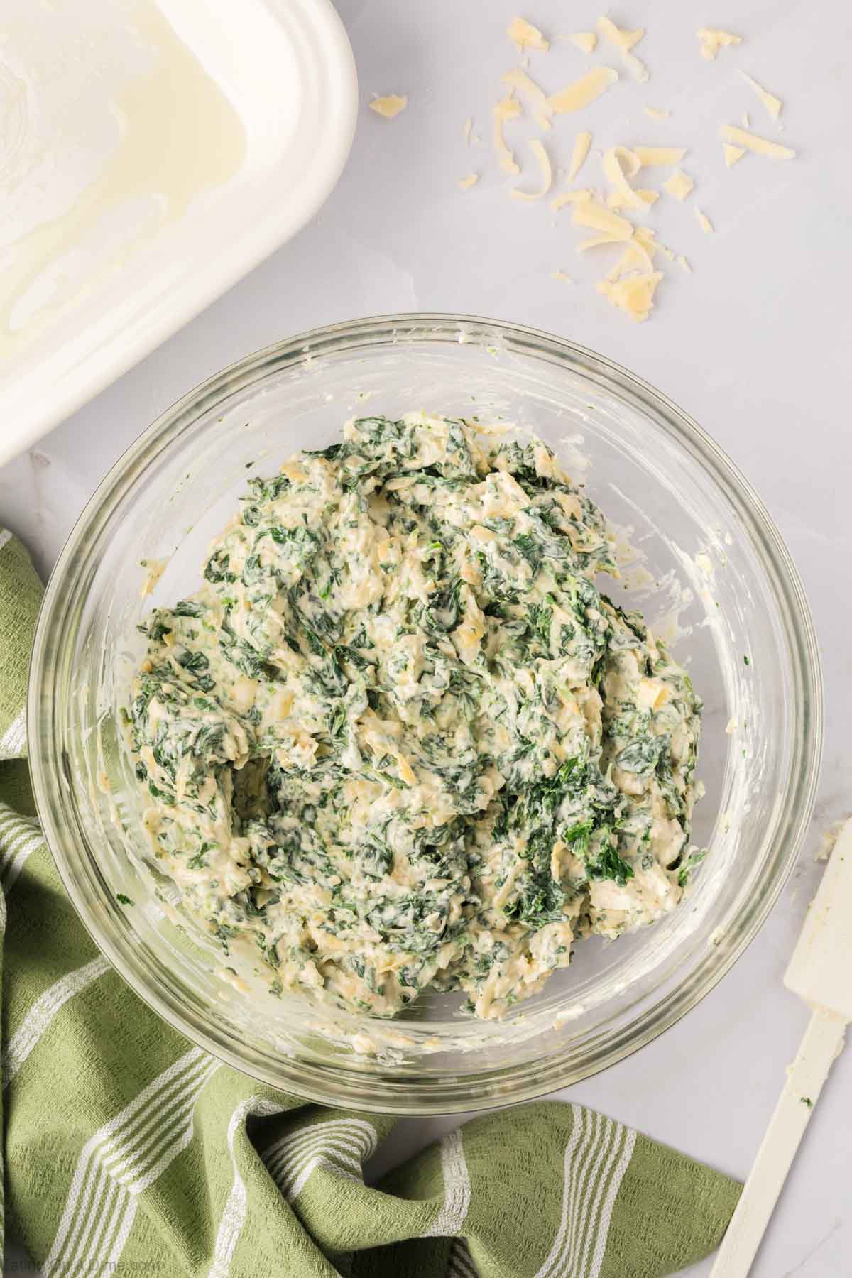 Stir in spinach, artichoke hearts, cheese and seasoning with the mayo mixture