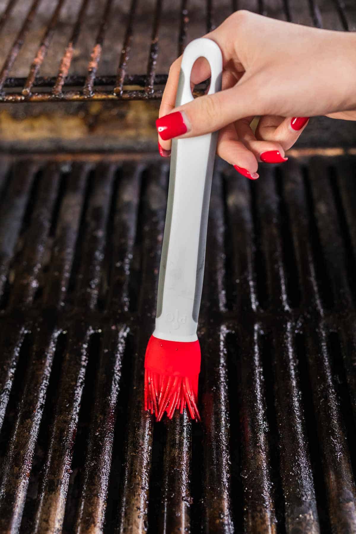 Brushing the oil on the grill grates
