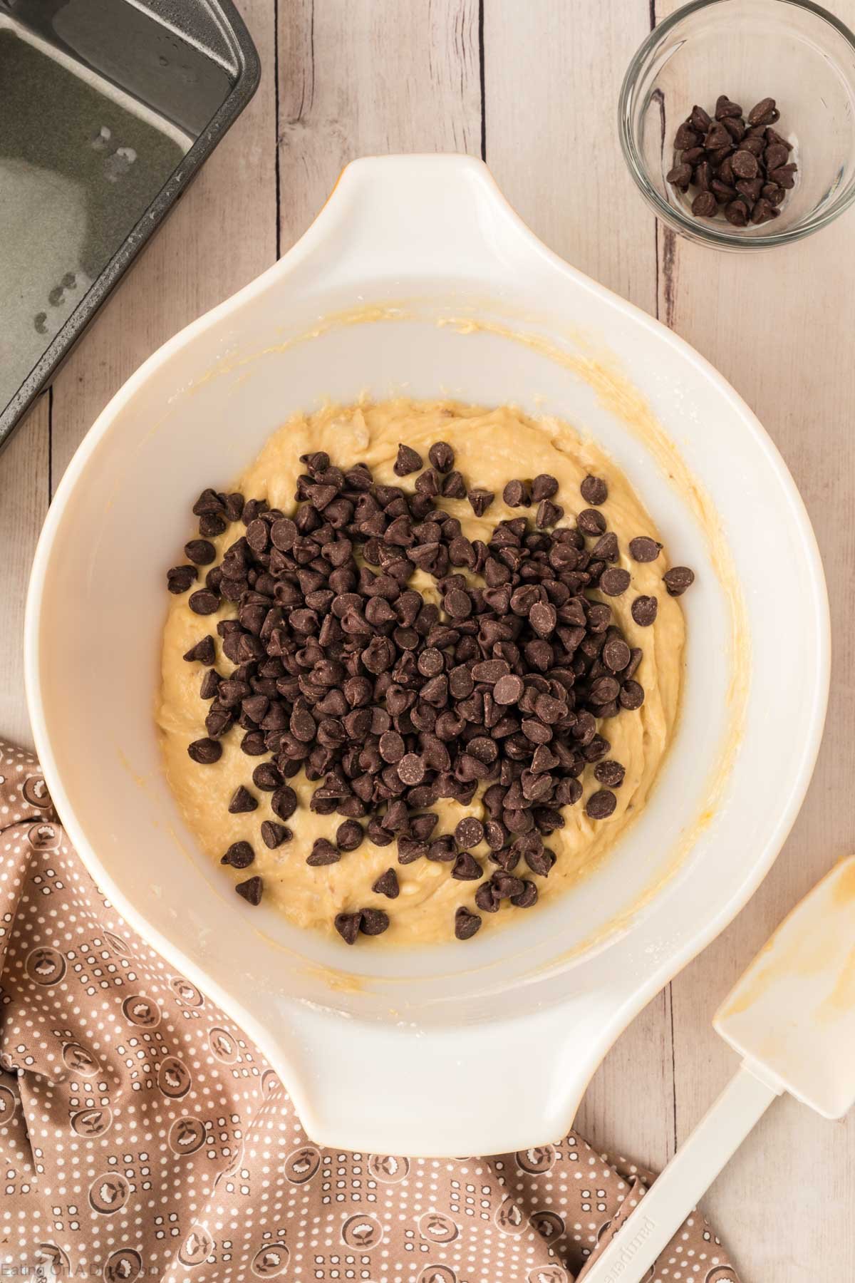 Adding in the chocolate chips into the banana bread batter