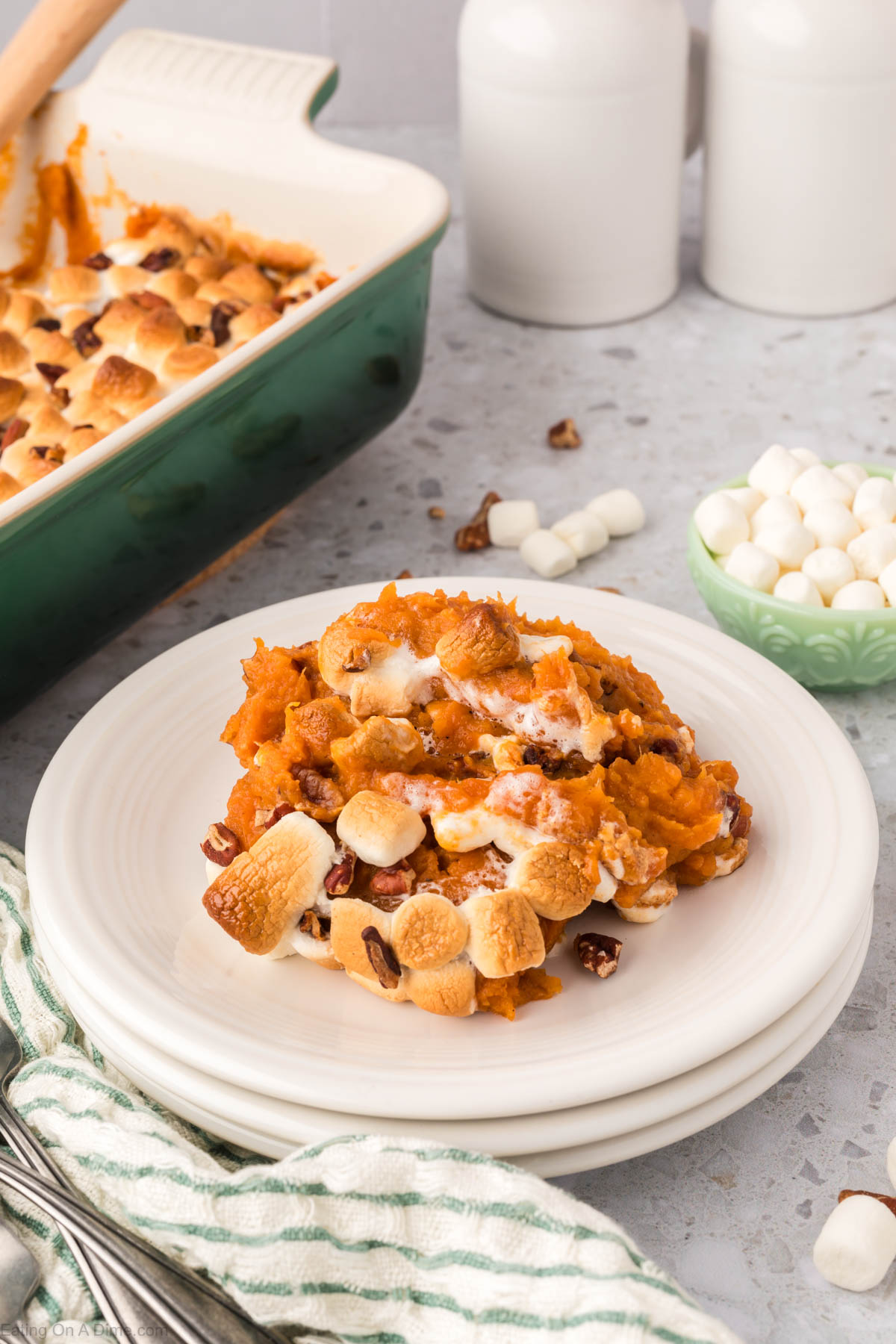 Sweet potato casserole with a serving on a plate