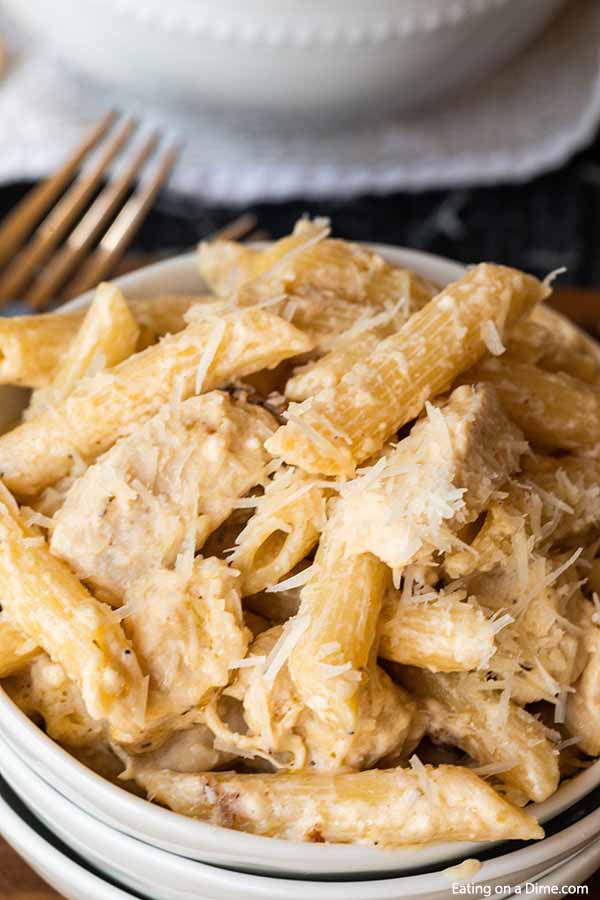Enjoy creamy and delicious Crock pot olive garden chicken alfredo pasta at home and save money. Let the slow cooker do all the work for the best slow cooker olive garden chicken pasta. Olive garden chicken pasta crockpot recipe with cream cheese is easy to make. #eatingonadime #crockpotolivegardenchickenpasta #crockpotrecipe