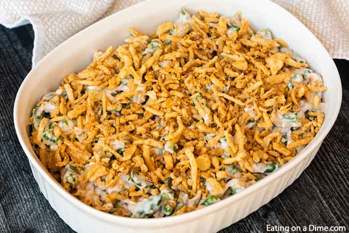 Close up image of green bean casserole in a white dish. 