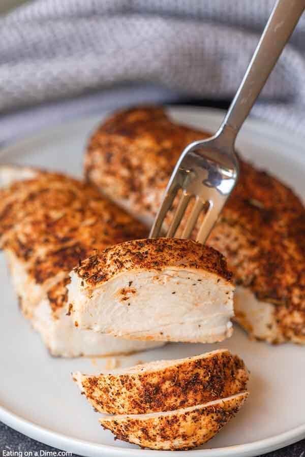 This easy baked chicken recipe has only a few ingredients and takes less than 30 minutes to bake in the oven. Learn how to bake chicken for an easy meal idea that is flavorful. Find out how to cook chicken for shredding, salads and more. How to bake chicken breast in oven. #eatingonadime #howtobakechicken #howtobakechickenintheoven #howtobakechickenintheovensimple #Intheovenhealthy #intheovenrecipes #intheovenjuicy #intheoveneasy