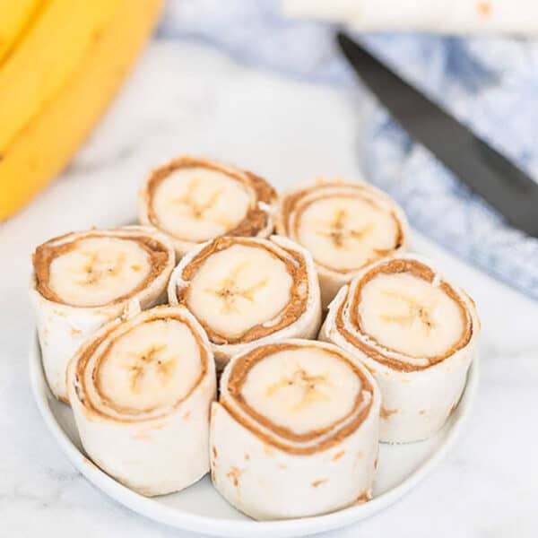 You have to try this easy Banana Peanut Butter Roll ups for an easy after school snack. These 3 ingredient banana peanut butter rolls are always a favorite!