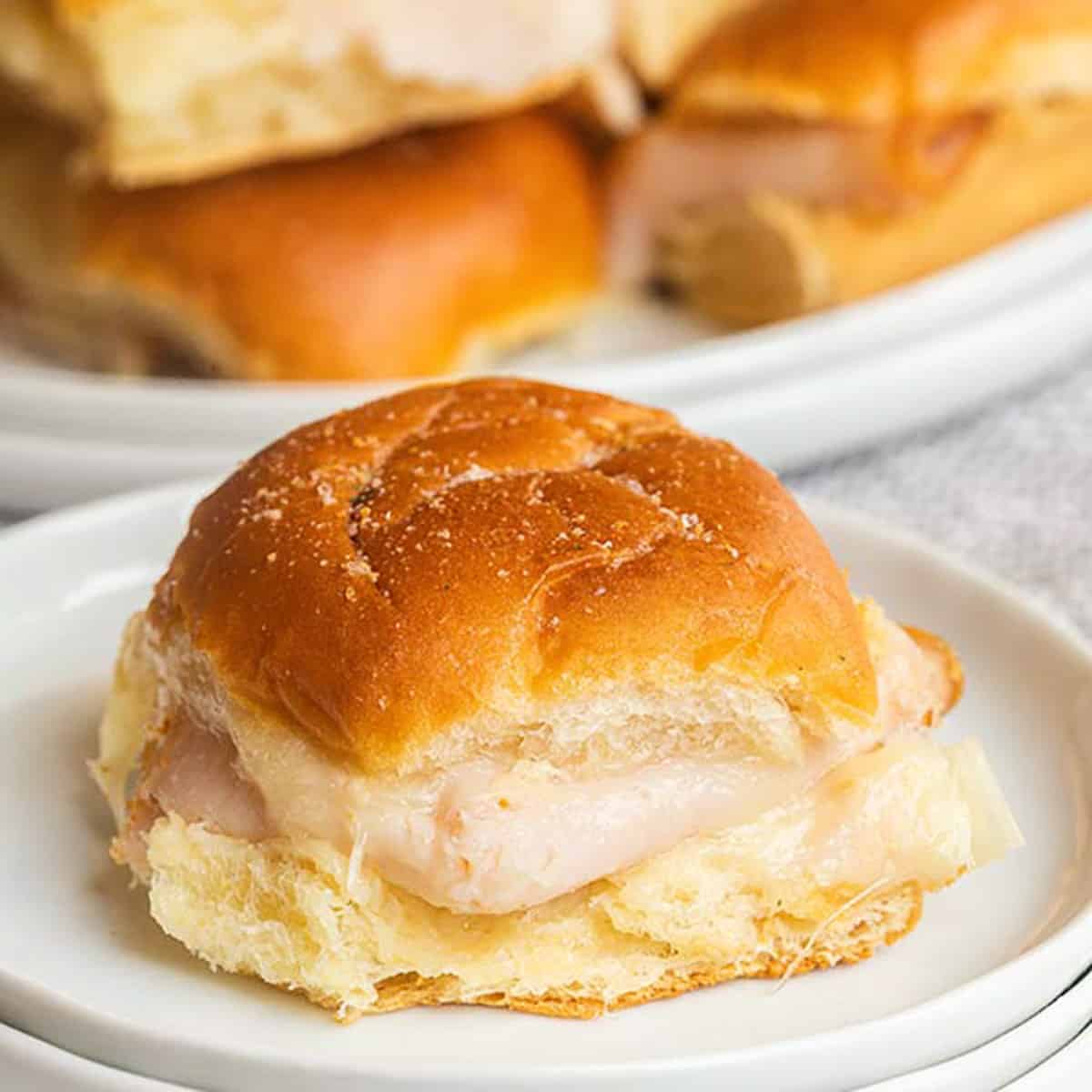 These quick and easy Hawaiian turkey and cheese sliders are the best for feeding a crowd! Hawaiian roll turkey sliders are our go to recipe for party food!