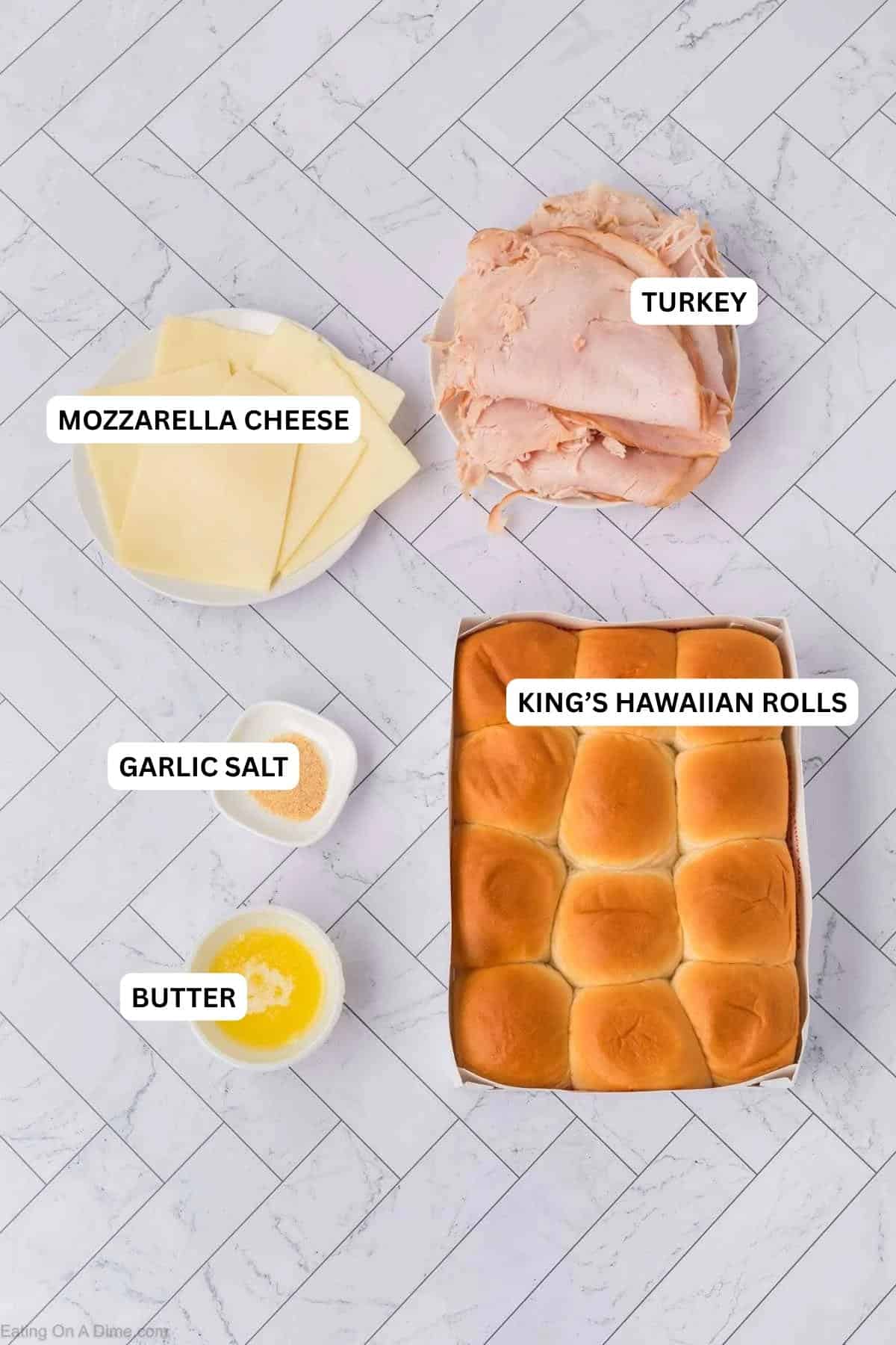 Ingredients for recipe: butter, garlic salt, rolls, cheese and turkey.