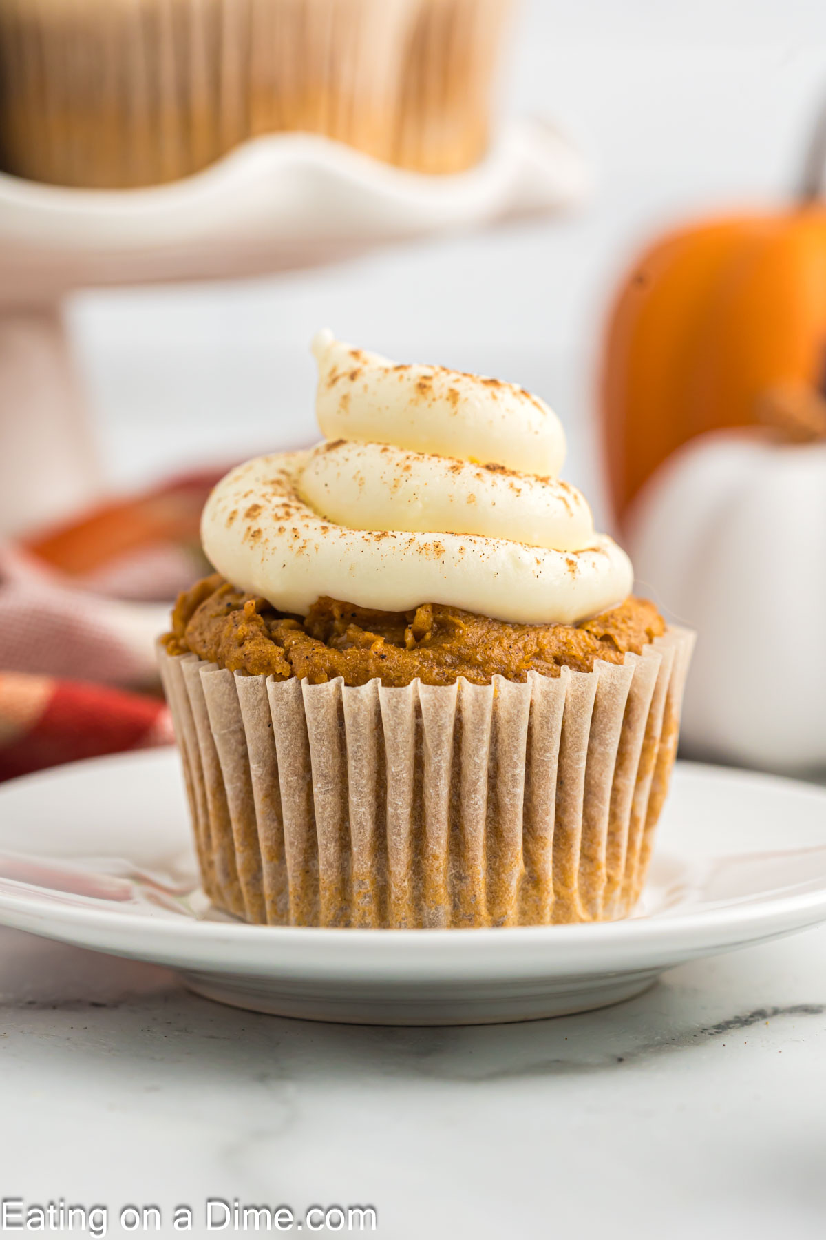 Pumpkin Cupcake topped with cream cheese frosting