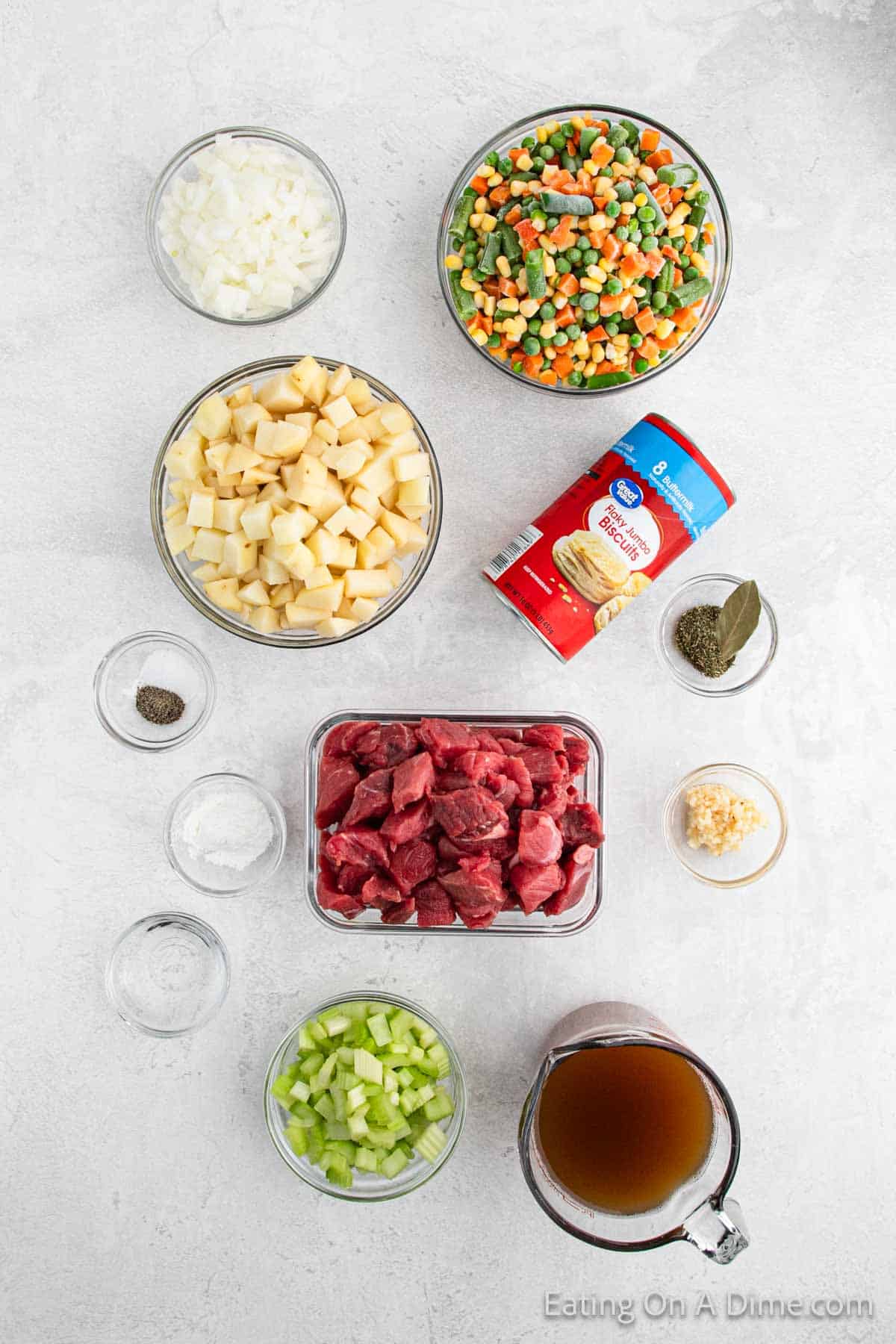Ingredients - Stew Meat, mixed vegetable, celery, onion, salt, pepper, minced garlic, thyme, bay leaf, potatoes, beef broth, cornstarch, water, biscuits