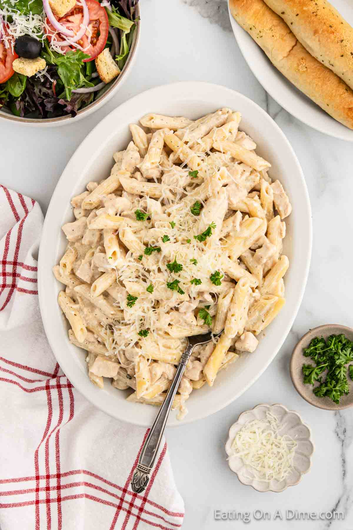 Close up image of chicken alfredo pasta  on a platter