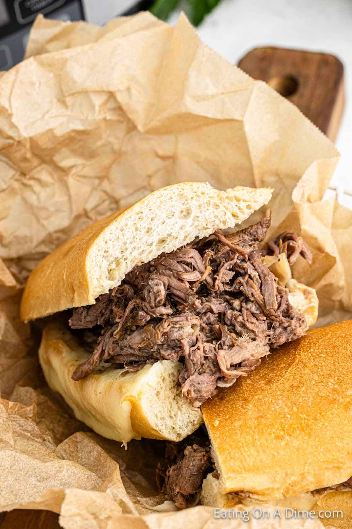 Shredded beef sandwich wrapped in parchment paper