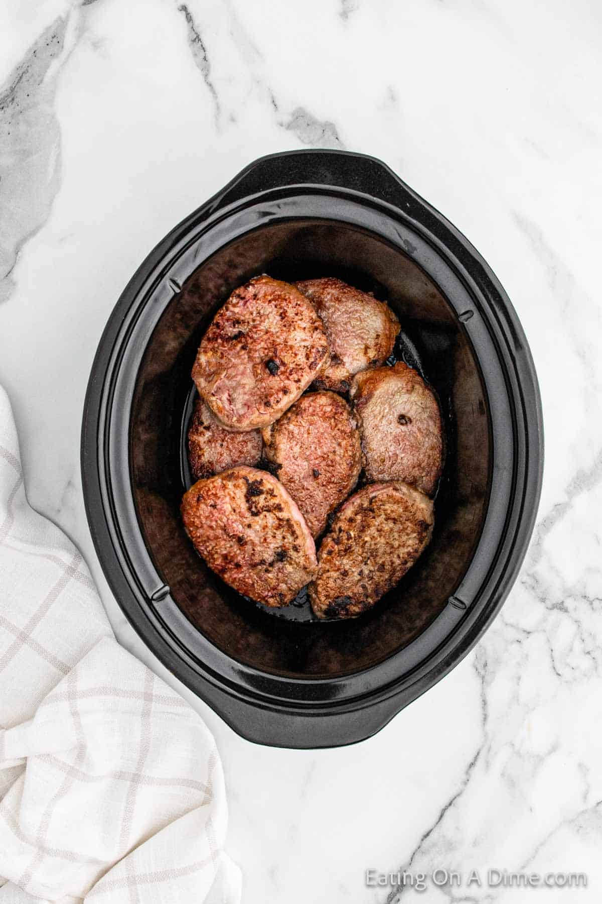 Browned swiss steak in the slow cooker