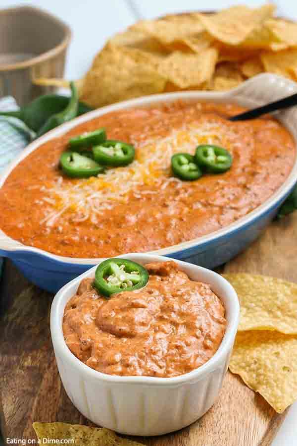 Chili cheese dip recipe is the perfect appetizer when you are craving comfort food. It is the best dip and so inexpensive to make. Chili cheese dip with cream cheese is easy and delicious served warm out of the oven. Try this homemade hot chili cheese dip with no beans. #eatingonadime #chilicheesedip #creamcheese #chilicheesedipeasy