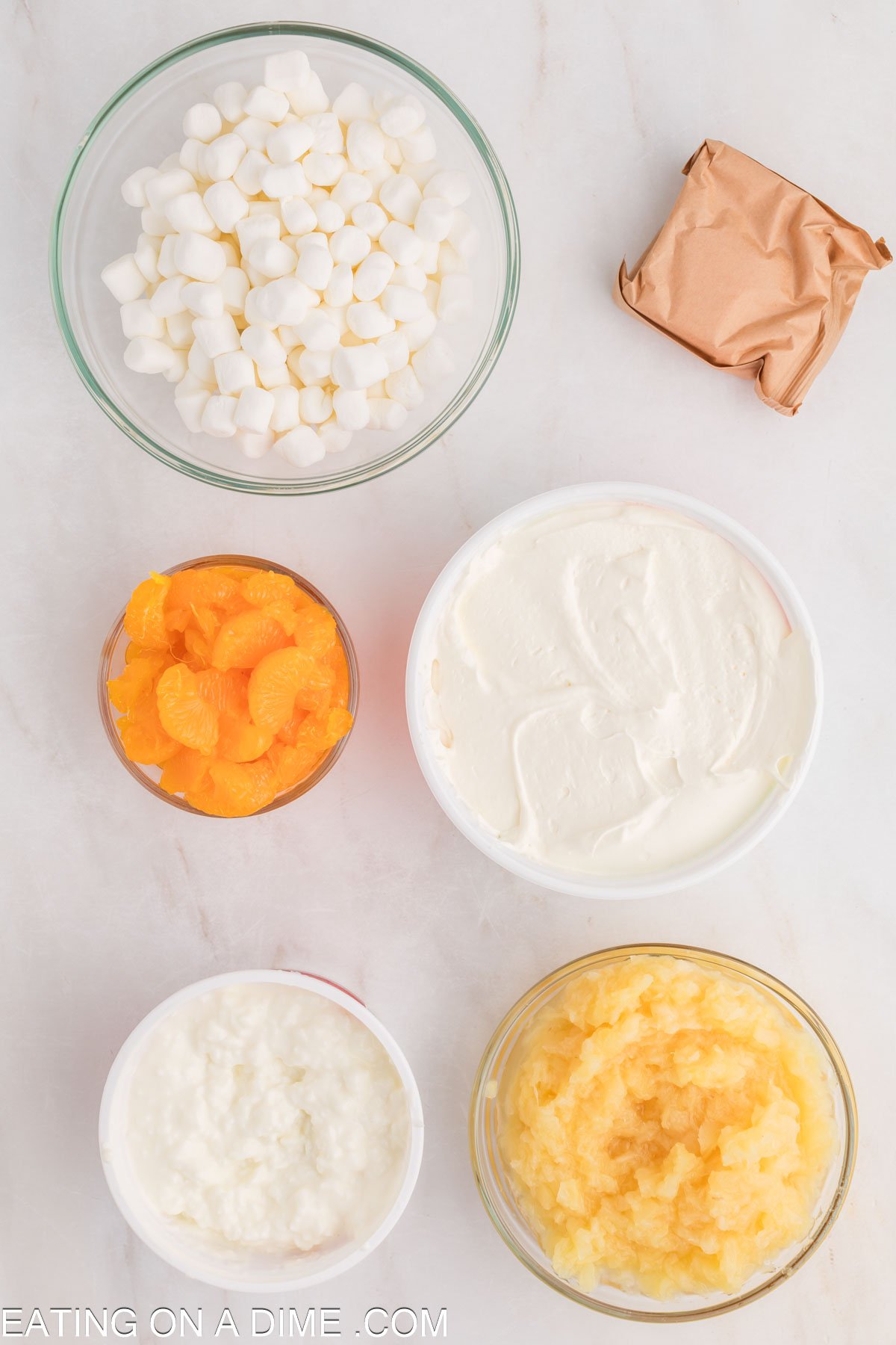 Cottage cheese, orange jello, mandarian oranges, marshmallows, crushed pineapple, whipped topping 