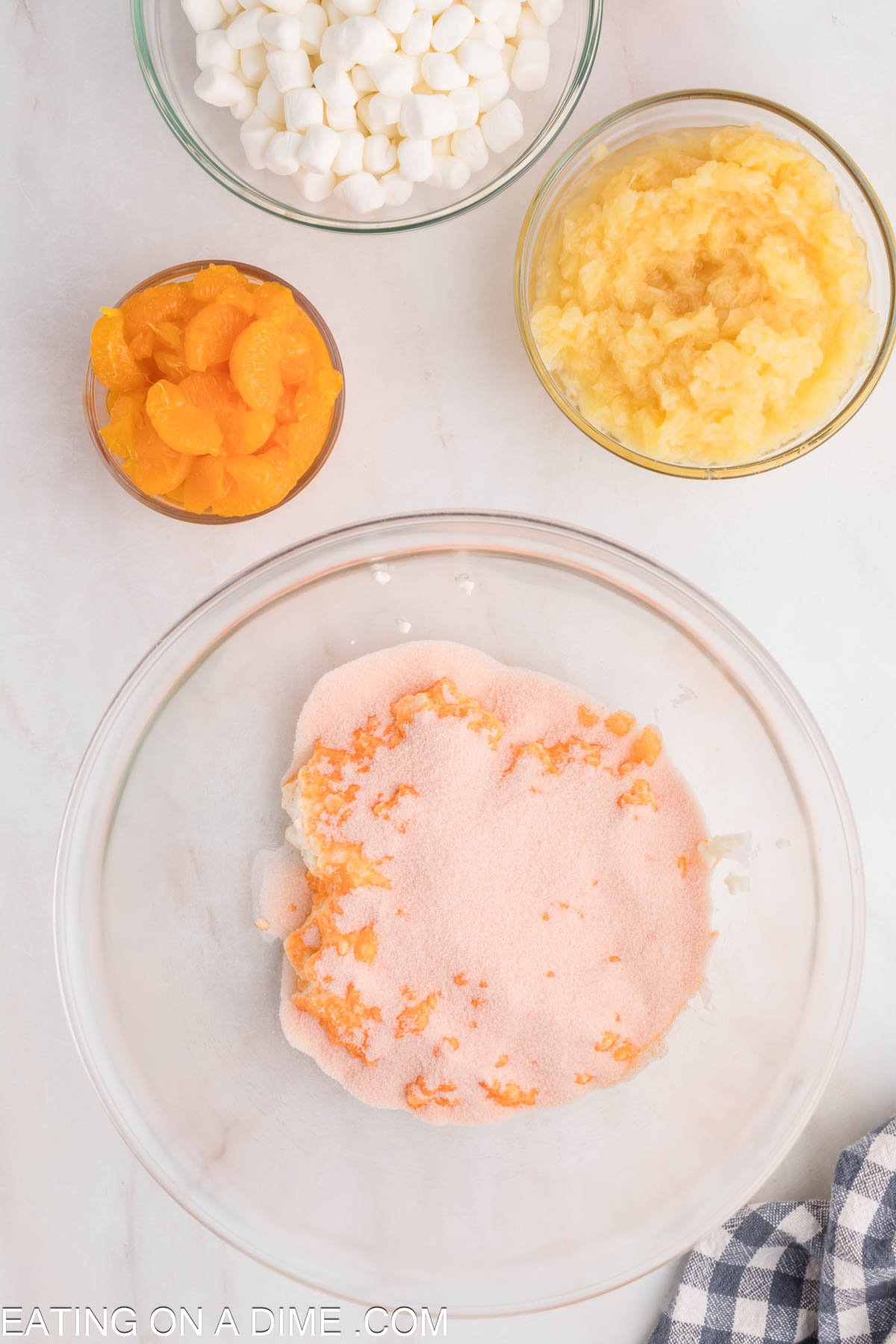 Topping the cottage cheese with the orange jello