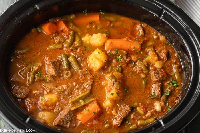 Close up image of beef stew in a crock pot. 