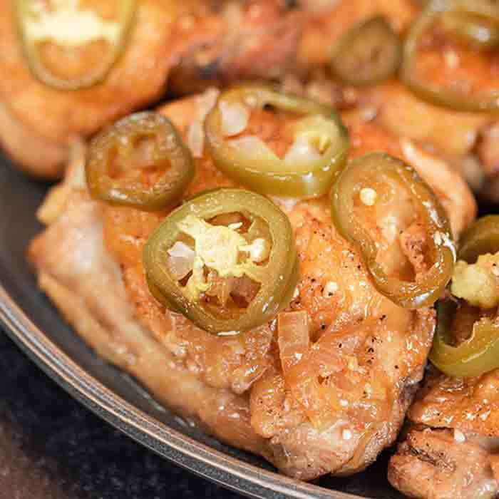 Slow cooker chicken adobo recipe is a Filipino inspired dish with garlic and vinegar infused chicken thighs. This healthy slow cooker meal is tasty over rice and easy to make in the crockpot. Learn how to make the best adobo chicken with a spicy marinade. #eatingonadime #chickenadobo #Philipino #Mexican #crockpot #adobochickenfilipinocrockpot
