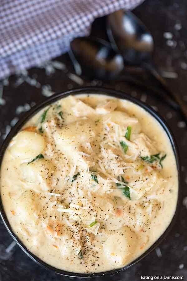  Crock pot olive garden chicken gnocchi soup will satisfy your Olive Garden craving. This creamy and hearty soup is easy and delicious. Make Olive Garden chicken gnocchi soup in crock pot for the best homemade copycat recipe. Chicken and gnocchi soup with heavy cream is easy in the slow cooker. #eatingonadime #olivegardenchickengnocchisoup #crockpot 
