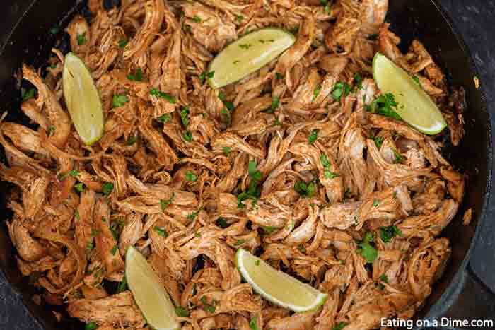 Get dinner on the table in 30 minutes with this easy and authentic Mexican shredded chicken recipe. The options are endless for salads, tacos, burritos, nachos and more! Learn how to make the best juicy shredded Mexican chicken on the stove top. #eatingonadime #mexicanshreddedchickenrecipe #quickdinners #keto #recipes