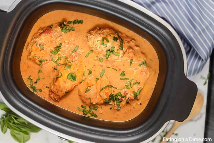 Slow cooker tomato basil chicken recipe is so creamy with the best tomato sauce. The crock pot makes it easy. Crock Pot Tomato Basil Chicken is great with rice or pasta. Everyone will go crazy over Slow Cooker Tomato Basil Chicken recipe. #eatingonadime #tomatobasilchicken #slowcooker #slowcookercreamy