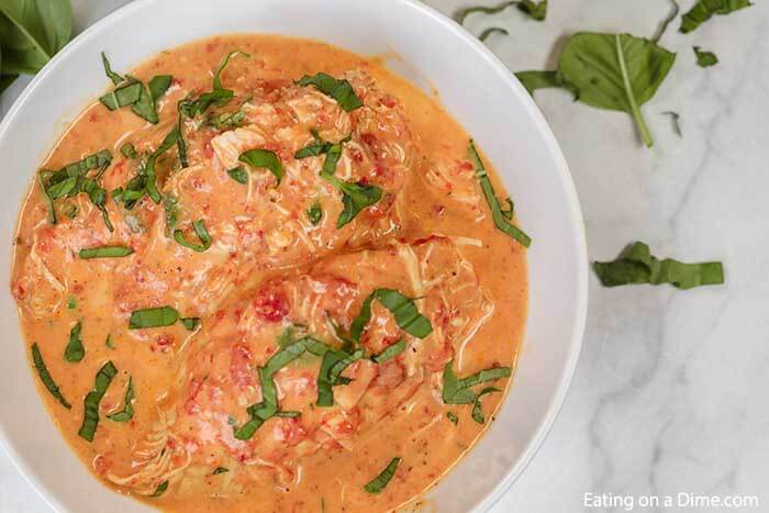 Slow cooker tomato basil chicken recipe is so creamy with the best tomato sauce. The crock pot makes it easy. Crock Pot Tomato Basil Chicken is great with rice or pasta. Everyone will go crazy over Slow Cooker Tomato Basil Chicken recipe. #eatingonadime #tomatobasilchicken #slowcooker #slowcookercreamy