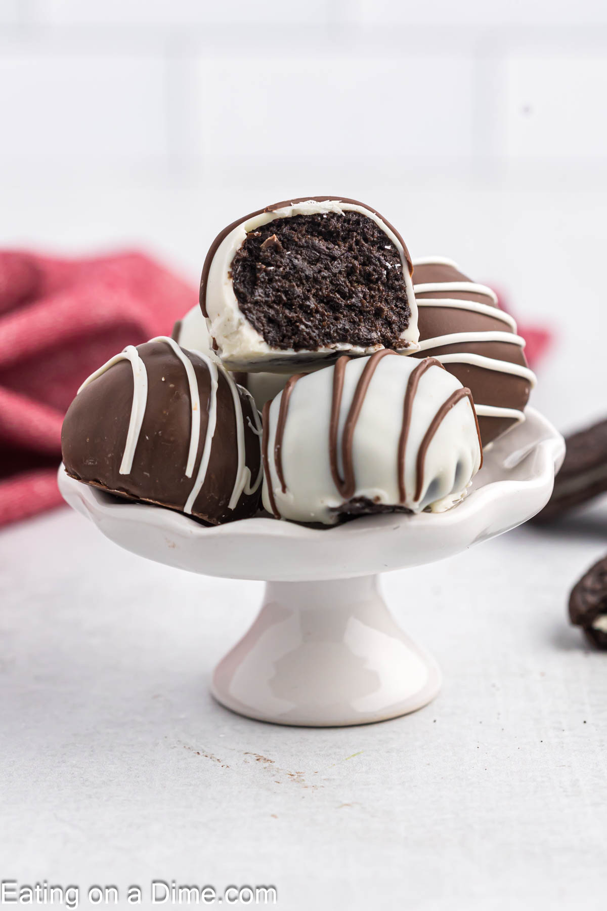 Oreo Truffles stacked on a cake stand