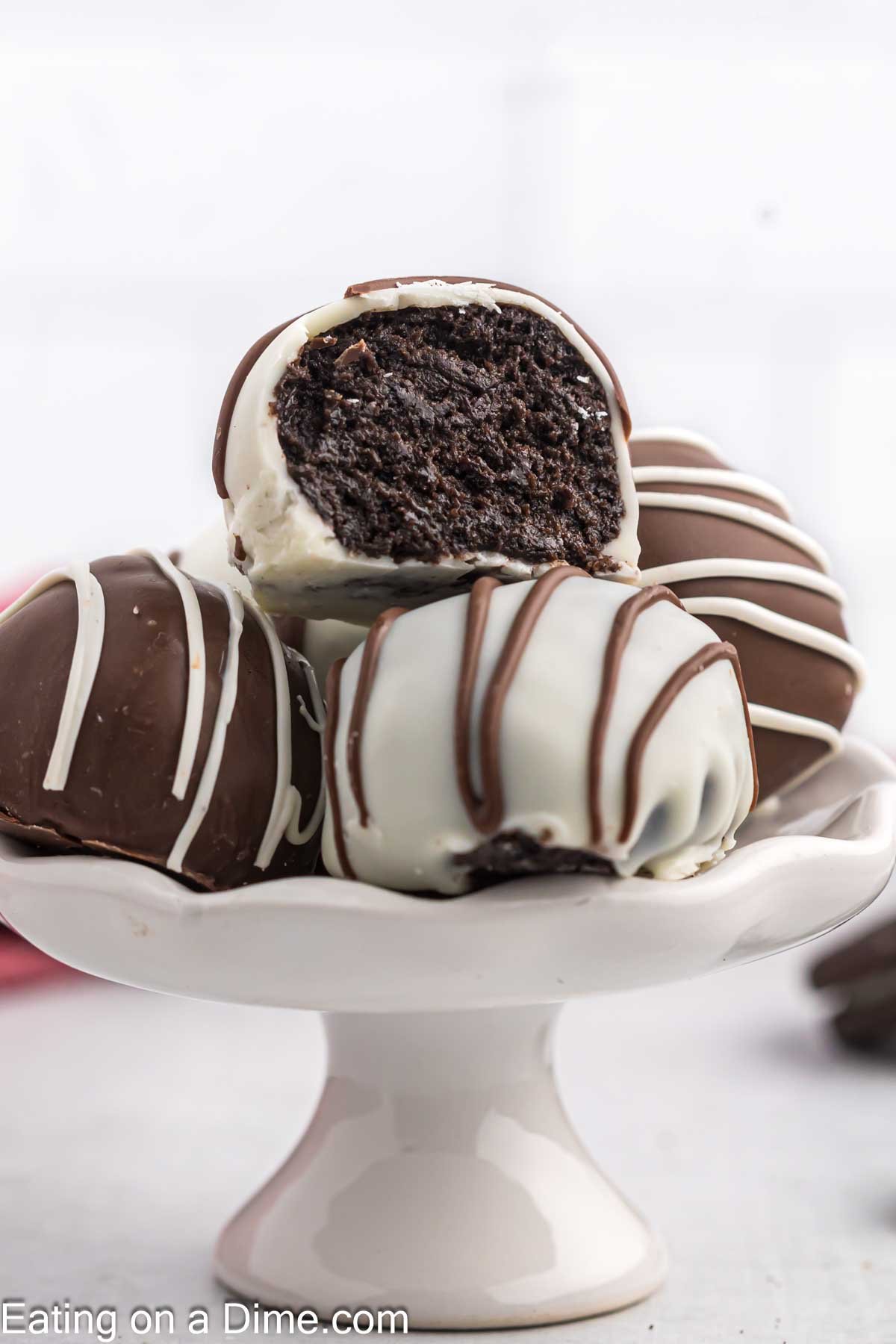 Oreo Truffles stacked on a cake stand