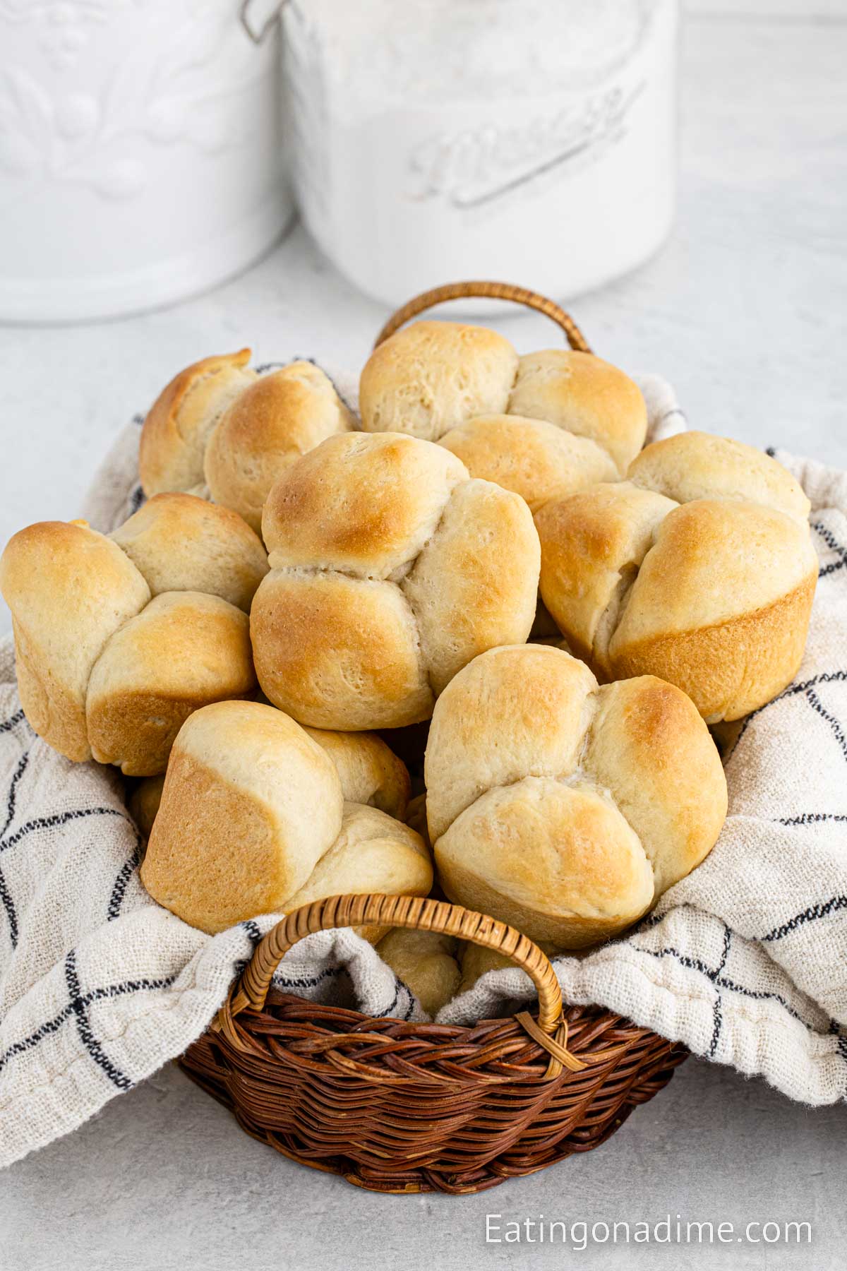 Homemade dinner rolls stacked in a basket