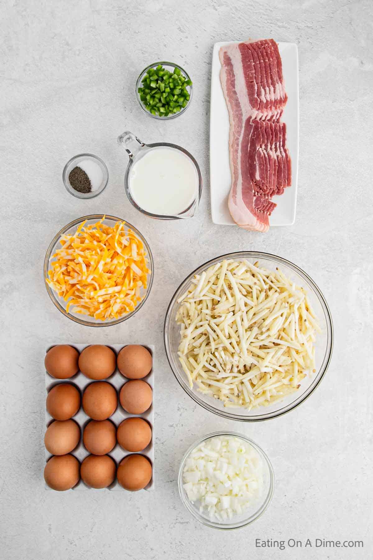 Bacon Egg Casserole Ingredients - bacon, onion, eggs, bell pepper, milk, hash brown, cheese, salt and pepper