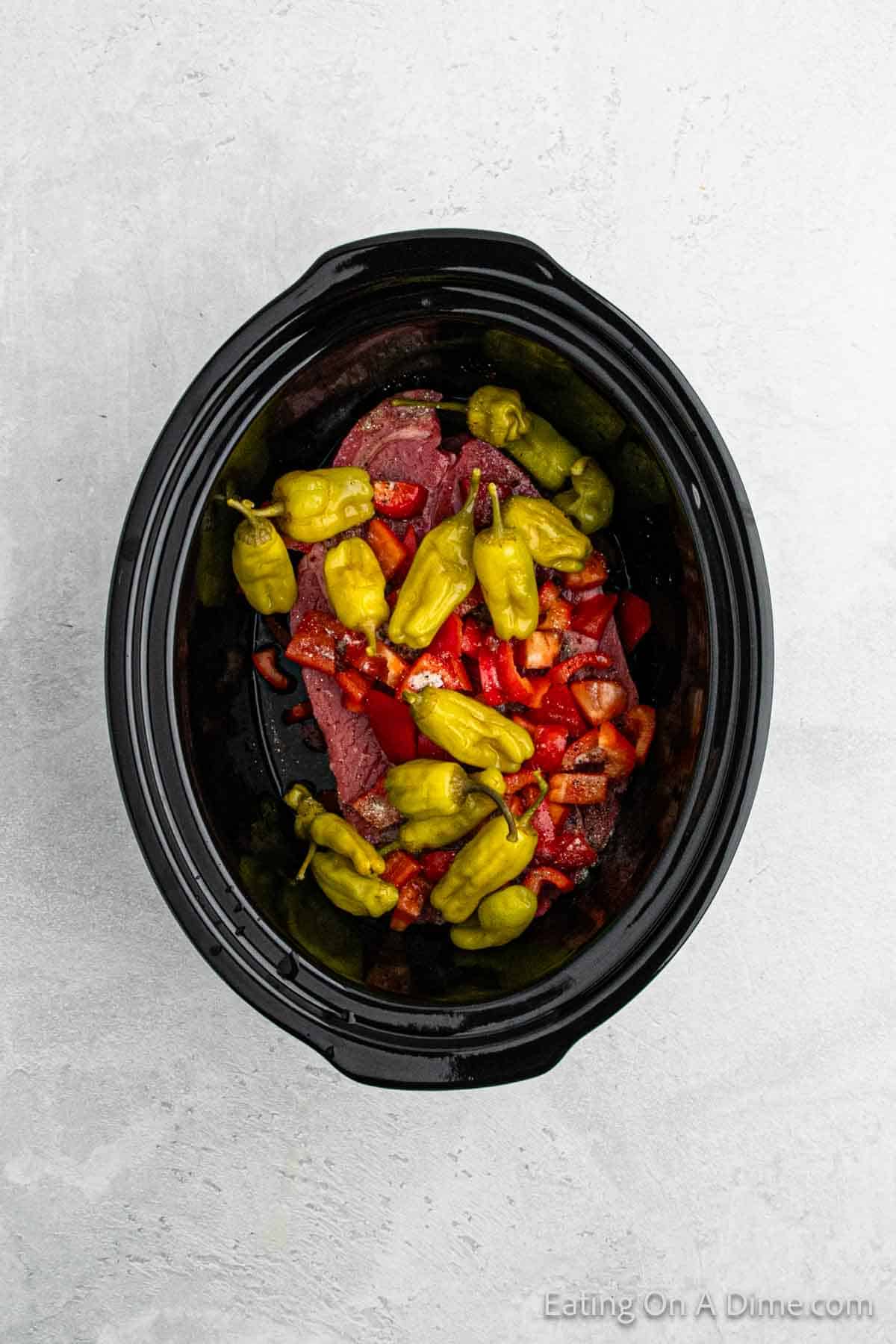 Top the roast with pepperoncini peppers