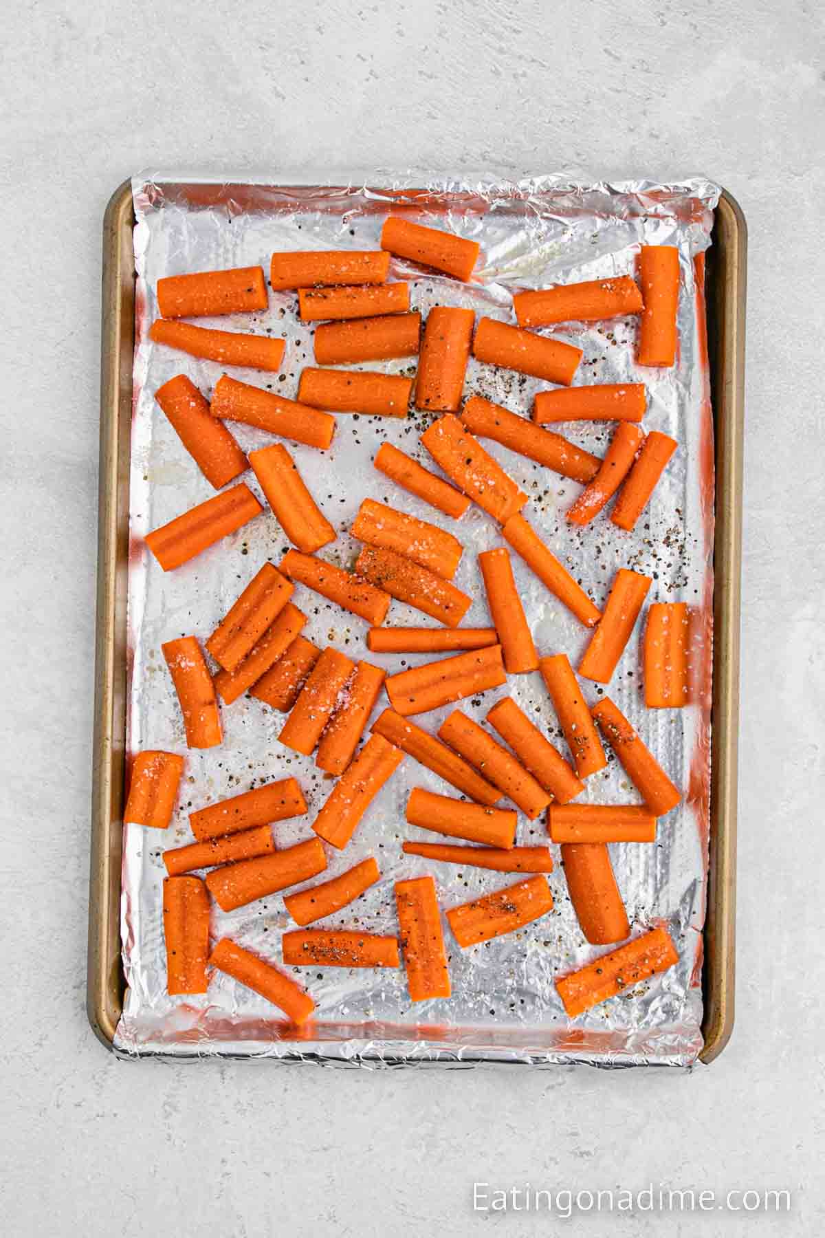 Adding the seasoning to the carrots