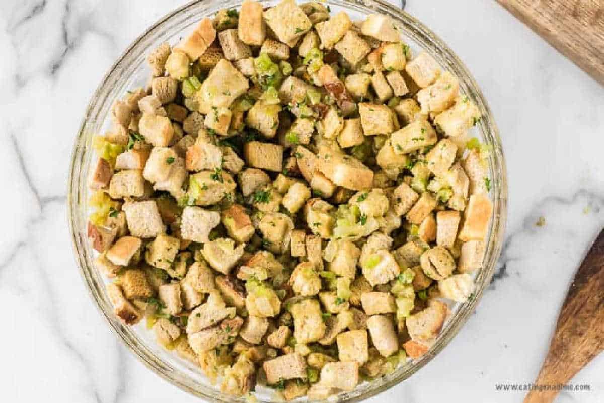 Stir in eggs and dry bread cubes to the veggies mixture.