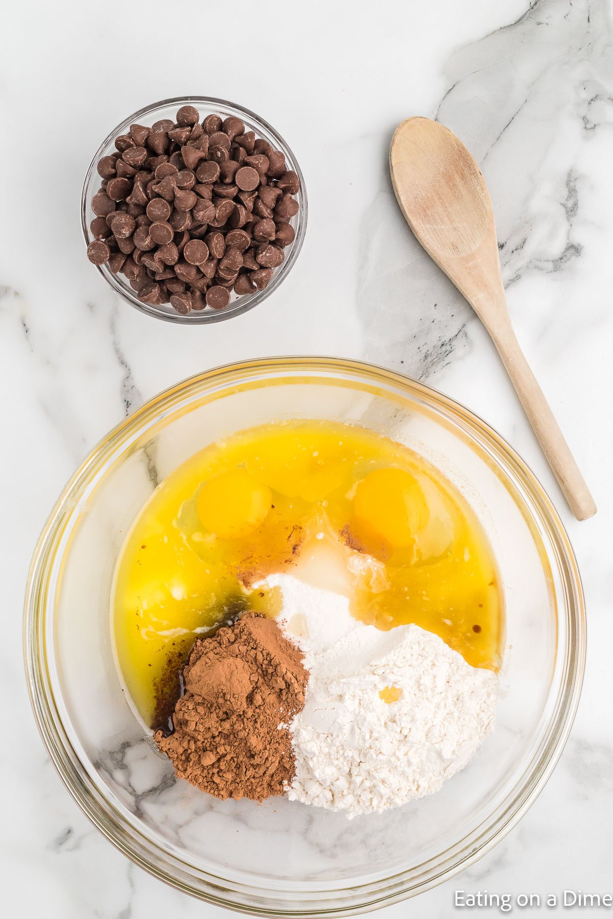 Combining the brownie ingredients together in a bowl